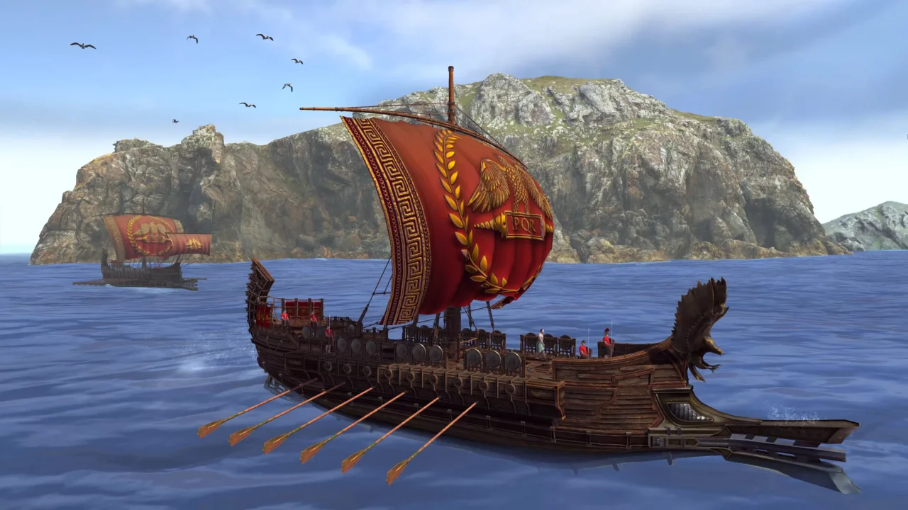 Roman warship with a large red SPQR eagle sail and oars, sailing near a rocky coastline; crew visible on deck—screenshot from Pompeii: The Legacy.