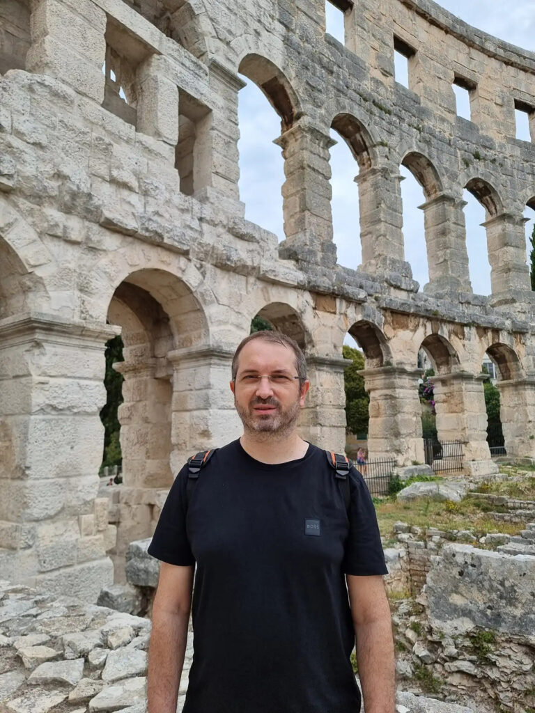 Portrait in front of the Pula Amphitheatre in Istria, Croatia.