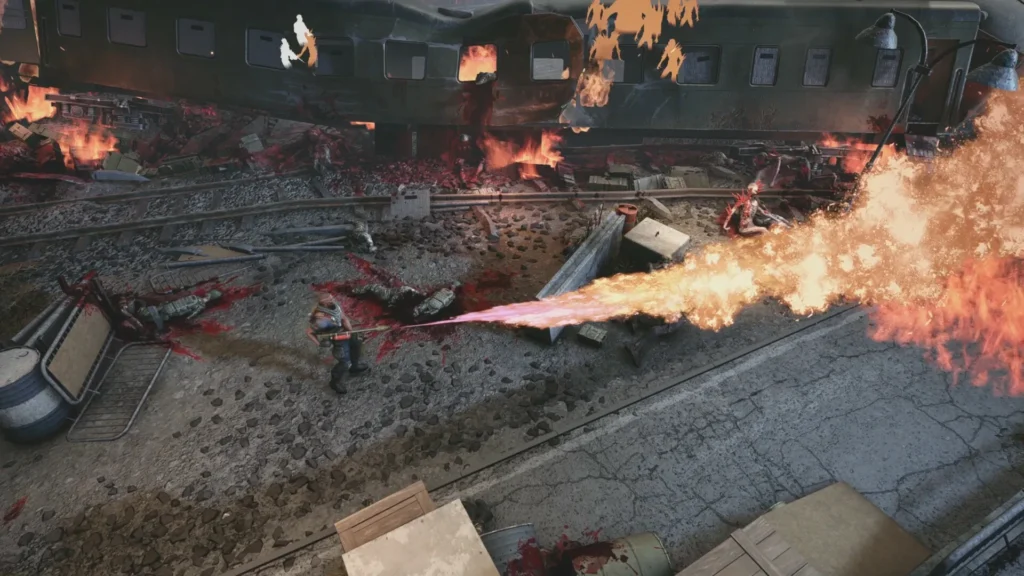 Chains of Freedom combat moment featuring a soldier using a flamethrower against enemies near a destroyed train, with intense fire effects and battlefield debris.