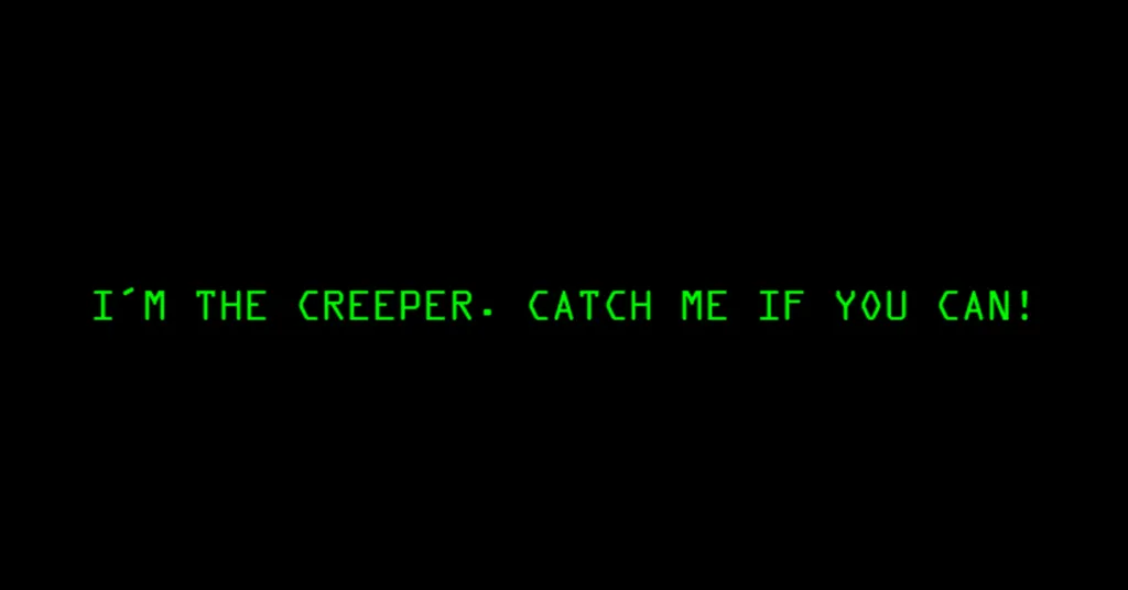 Green digital text on black screen reading ‘I’m the creeper. Catch me if you can!’ representing the first computer virus.