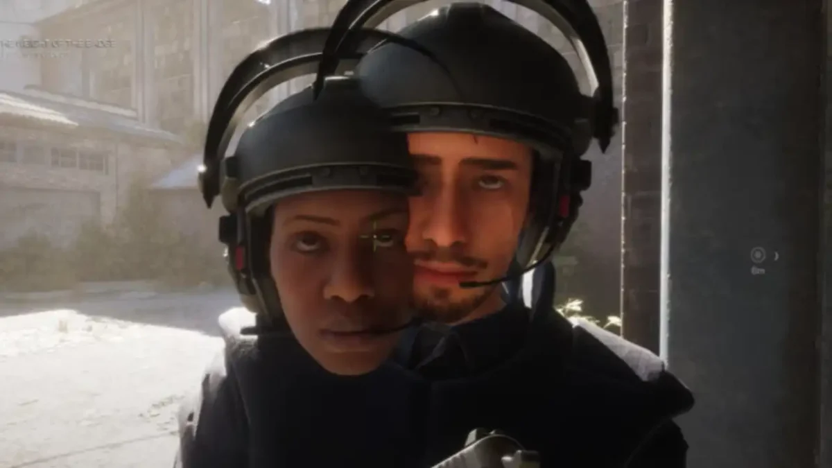 Two NPC police officers in RoboCop: Unfinished Business overlap completely due to a severe model clipping bug, with both faces and helmets merged into one.
