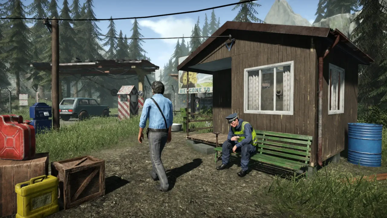 A small border booth while an officer rests on a bench at a forest checkpoint.