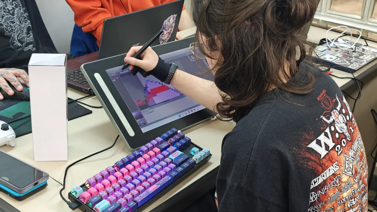 Developer creating pixel art on a desktop monitor