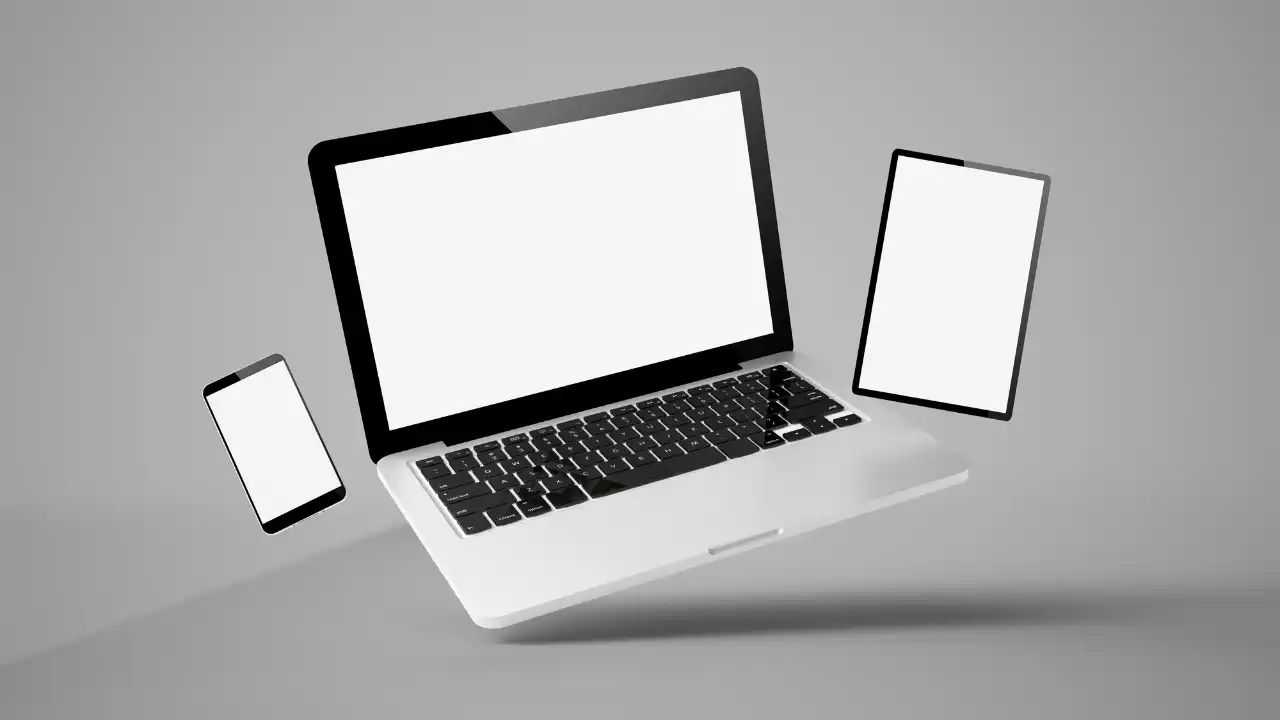 Laptop, smartphone, and tablet representing PC game streaming across devices