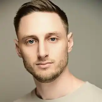 Headshot of voice actor Brian Watts