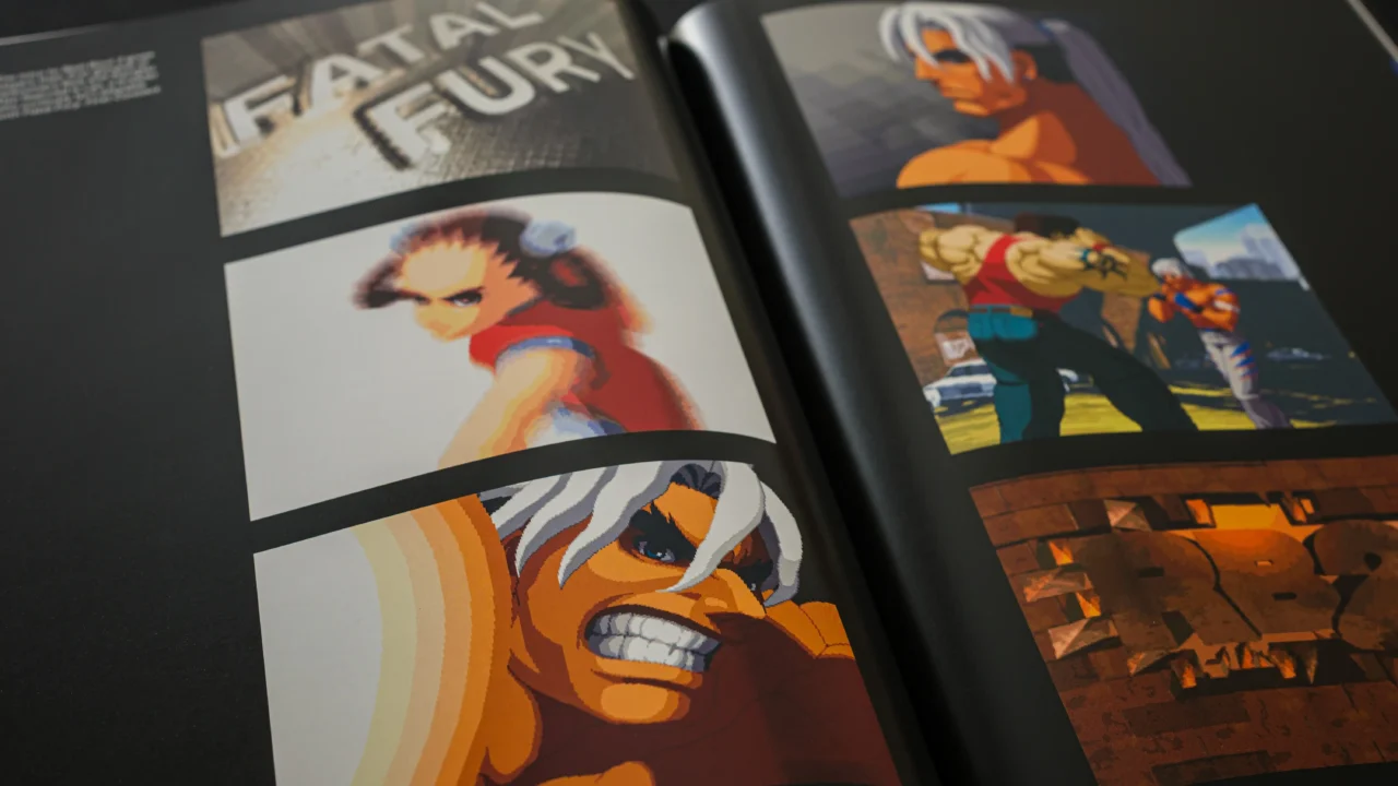 Open Fatal Fury Ultimate History book showing character artwork and gameplay screenshots