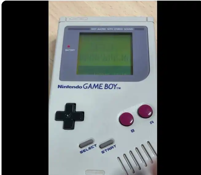 Original gray Nintendo Game Boy displaying the DMGo drum-machine interface during a mangling-mode demonstration.