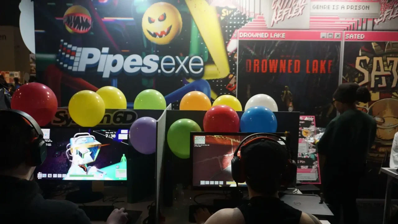 Attendees playing Pipes.exe at the Critical Reflex booth during PAX West 2026