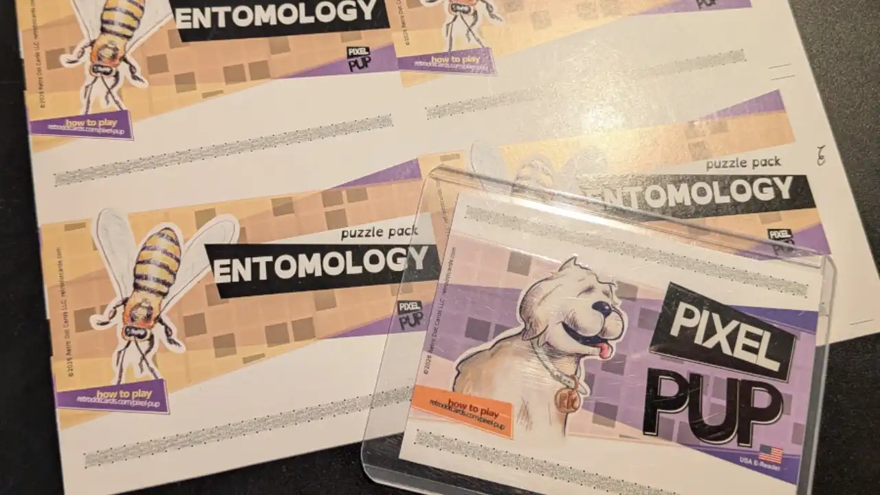 Several printed Pixel Pup Nintendo e-Reader cards laid out together.