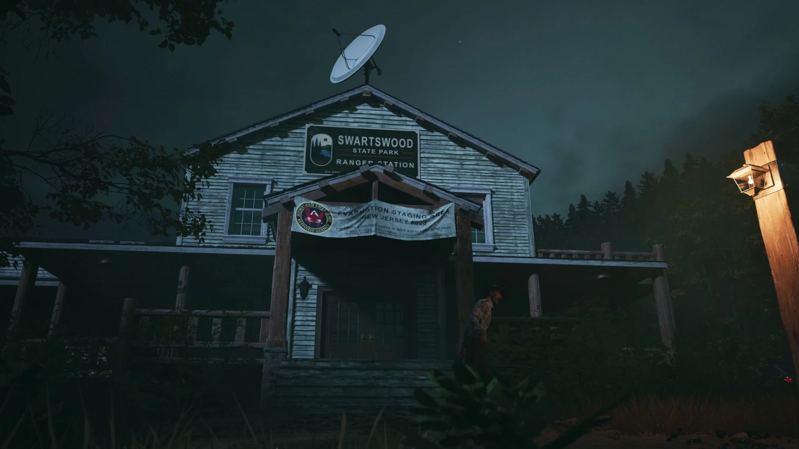 A wooden camp building with a satellite dish and illuminated lamp on the Ruby Lake map in No More Room in Hell 2.