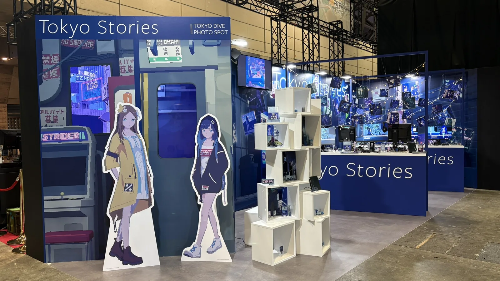 Tokyo Stories exhibition booth with character standees, demo stations and a Tokyo Dive photo spot.