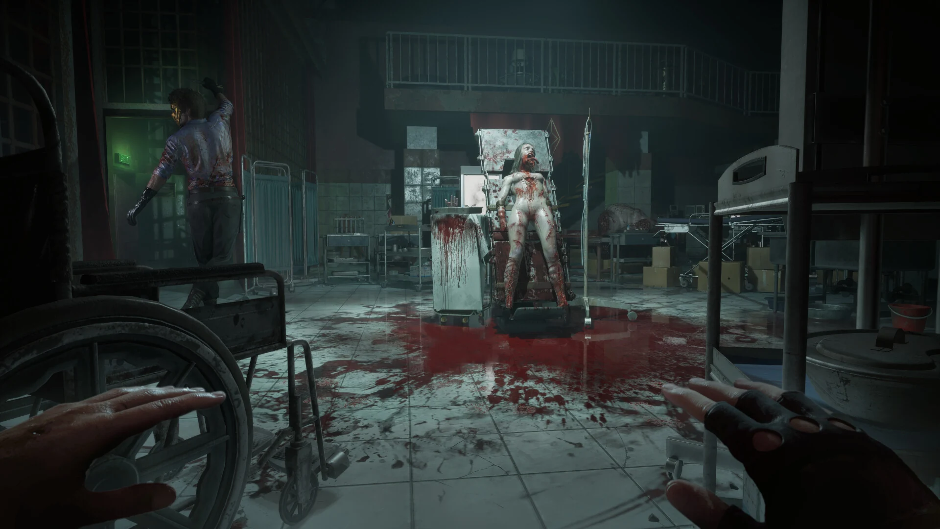 Bloodstained medical room with a figure strapped to a chair and a wheelchair in the foreground in Hellraiser: Revival.