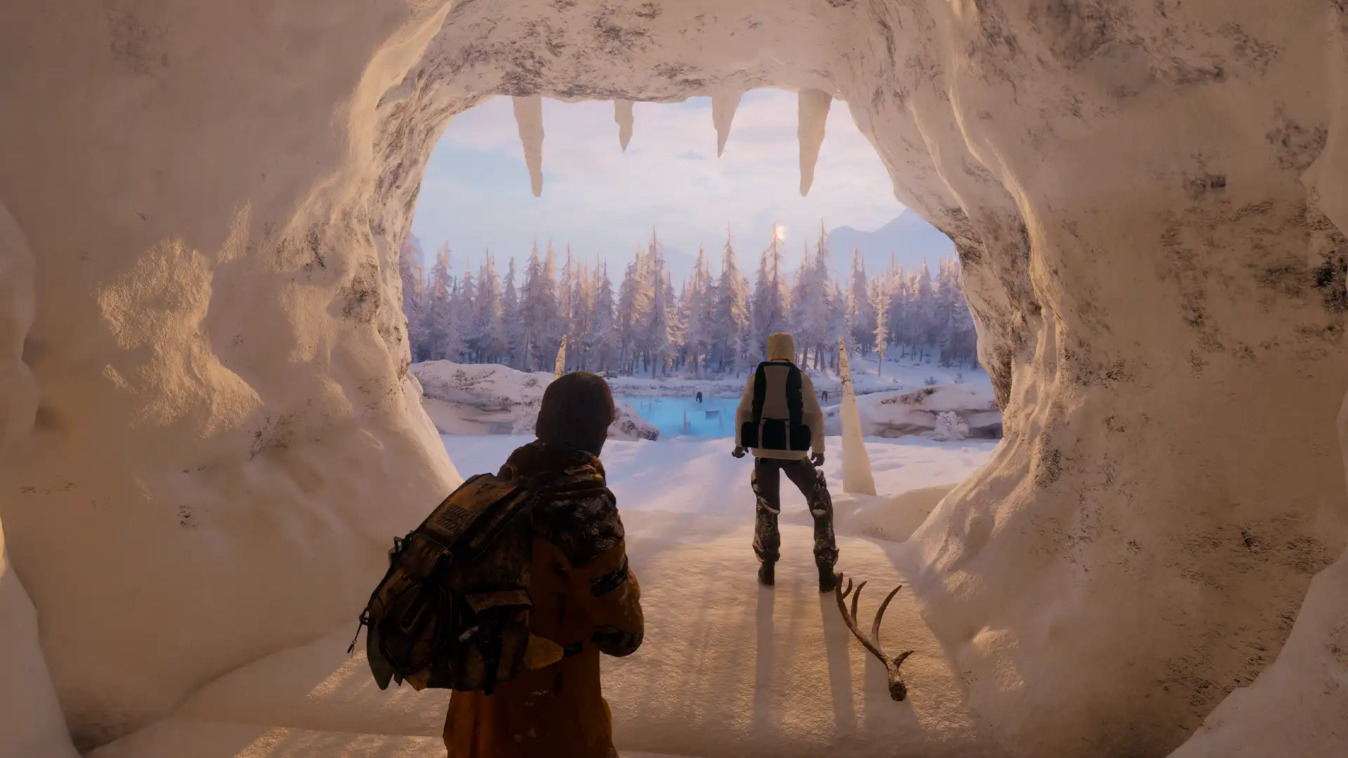 Two survivors looking out from an ice cave toward a snowy forest in Permafrost.