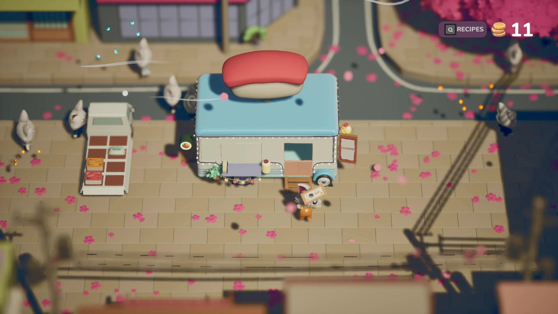 A blue-and-white sushi truck with an oversized sushi decoration on its roof stands on a street lined with pink petals and animal characters.